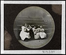 [Four young girls on stoop.]