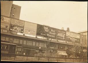 Street Scenes, etc. Showing Displays of Liberty Loan Posters during World War I [Billboards above stores including one for Liberty Loans.]