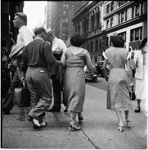 New York City Scenes: Fashion Shots [Group of men and woman walking down the street.]