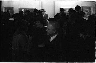 [Social gathering at art gallery.]
