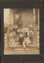 [Al Smith and his family on a porch.]
