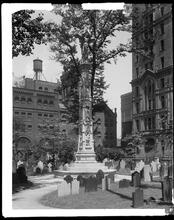 Broadway and Wall Street. Astor Memorial, churchyard cross, Trinity Churchyard.