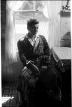 Leonard Bernstein [Leonard Bernstein sitting at a table in a robe.]