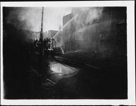 [Firemen at scene of fire.]