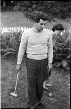 Leonard Bernstein [Leonard Bernstein and a woman playing croquet.]