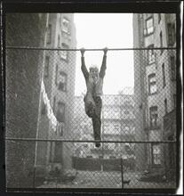 Shoe Shine Boy [Mickey climbing a fence.]