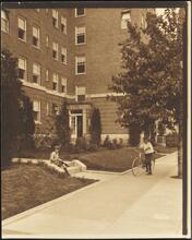 [Hawthorne Court. Apartment entrance and garden with children.]