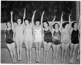 Holm, Eleanor- World's Fair N.Y. Swimming Pool [Eleanor Holm and students practicing the backstroke.]
