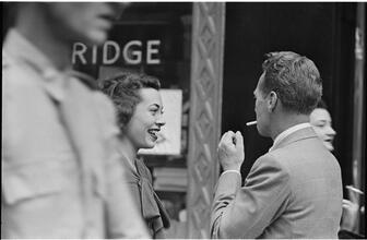 Street Conversations [Man and woman talking on the street.]