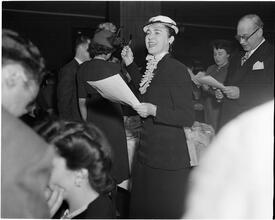 Dale Carnegie [Carnegie student leads class song at graduation exercises.]