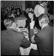 Champagne Cholly Book Party [People seated at a table.]