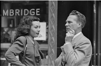 Street Conversations [Man and woman talking on the street.]