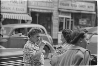 Street Conversations [Two women talking on the street.]