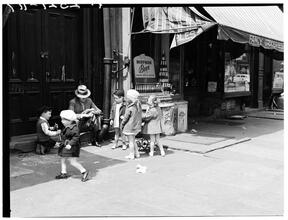 Children on Sidewalk; Man Sitting on Step
