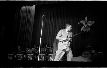 Vaughn Monroe [Man performing on stage.]