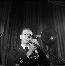 Swing Band Contest Sponsored by LOOK [Man playing the trombone.]