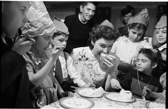 Deaf Children [Children eating cake at a party.]