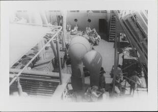 [Deck of ship with crew members.]