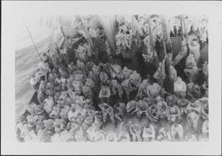 [Crew members on deck of ship.]