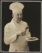 Portrait Chef Seres of H. Biltmore with plate of sliced bread.