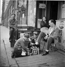 Shoe Shine Boy [Mickey shining shoes.]