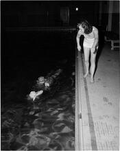 Holm, Eleanor- World's Fair N.Y. Swimming Pool [Eleanor Holm coaching students in the water.]