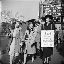 Advertising Sandwich Board [Woman wearing a sandwich board advertising the 1-2-3 cafe.]