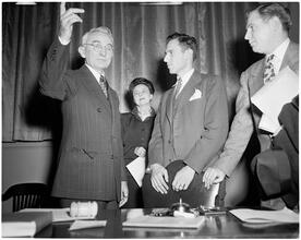 Dale Carnegie [Dale Carnegie talking to a group of people.]