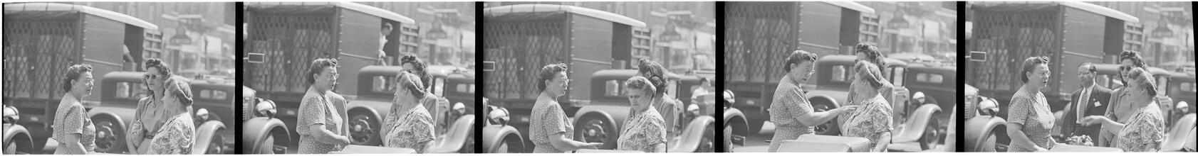 Street Conversations [Three women talking on the street.]