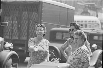 Street Conversations [Three women talking on the street.]