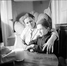 Boy and Mother at a Table