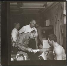 Rocky Graziano, He's a Good Boy Now [Man taping Rocky Graziano's hands.]