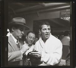 Rocky Graziano, He's a Good Boy Now [Rocky Graziano with men.]
