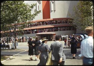 [Pedestrians and line outside the General Motors exhibits.]