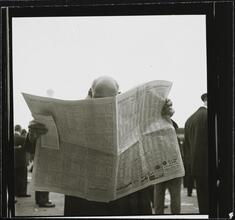 Aqueduct Race Track [Man reading a newspaper.]