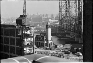 Changing New York [Church and building being demolished as a Circle Line boat passes.]