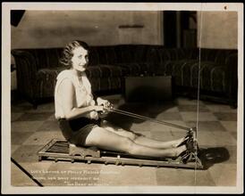 Lucy Levine of Molly Picon's Company Taking Her Daily Workout on "The Seat of Health"
