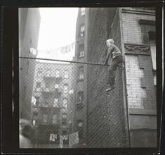 Shoe Shine Boy [Mickey climbing a fence.]