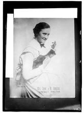 Miss Crump of the Crumperie [holding a ukulele]