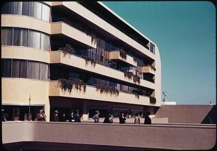 [People on a balcony of an unidentified building.]