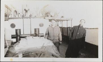 [Crew members on deck of ship.]