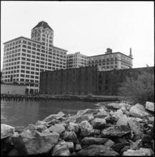 [Walentas Building, Sweeney Building and Empire Stores seen from the East River.]