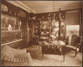 [Residence. Interior, parlor.]