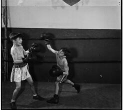 Boxing [at the] Police Athletic League [Two boys boxing.]