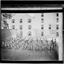Dumbell excercise in play yard -- public school at Monroe and Market Streets.