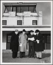 For 34 Years of Loyal Service - Eric S. Barron [Eric Barron with three other men.]