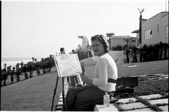 [Felicia Marsh painting outside.]