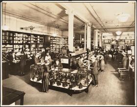 [Interior, camera store.]