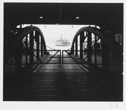 The Weehawken Ferry Story [Ferry terminal with ferry in distance.]