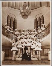 [Ed Wynn with the chorus girls in "Boys and Girls Together".]